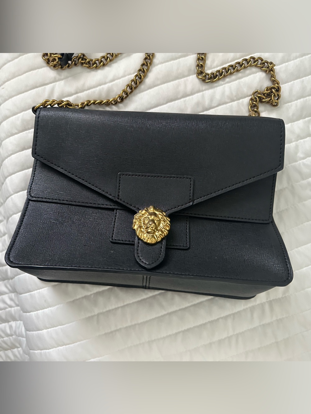Black Crossbody Bag with Gold Lion Medallion and gold chain detail